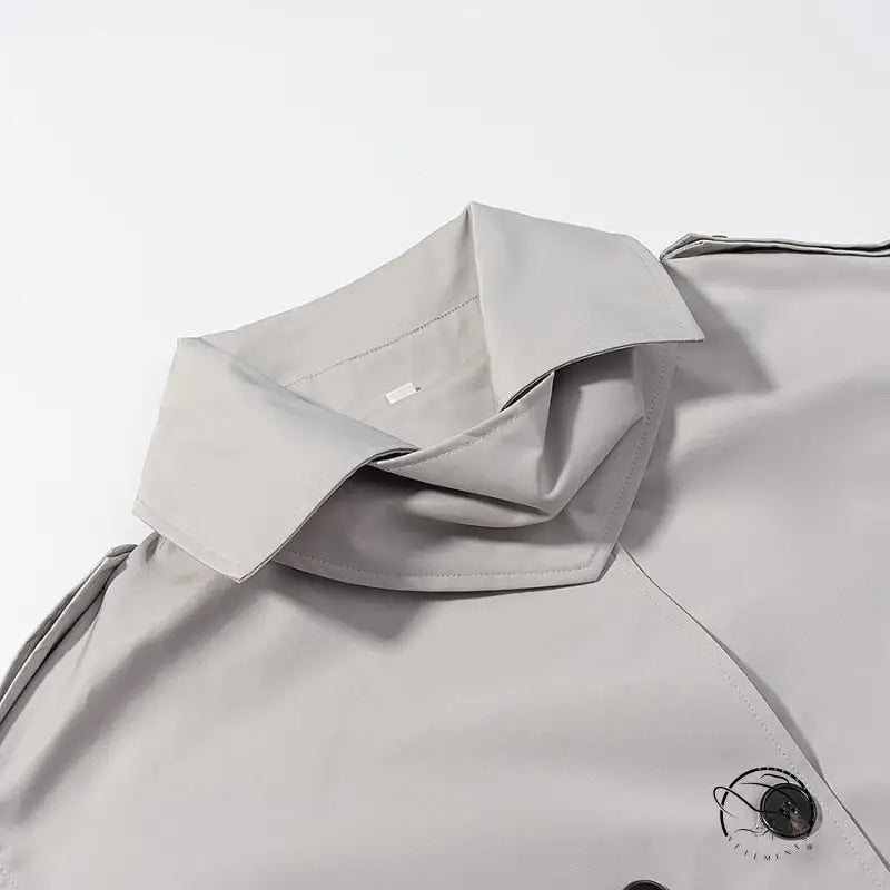 Light gray langry fashion trench coat with double-breasted buttons and black trim