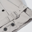 Beige trench coat with black buttons in Langry fashion ملابس