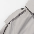 Light gray langry fashion trench coat with black buttons, double-breasted loose long sleeve design