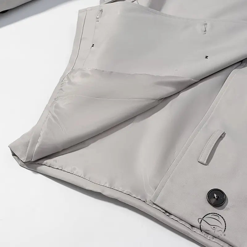 Light gray langry fashion puffer jacket with black buttons and white trim