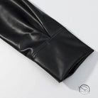 Black faux leather gloves paired with stylish simple short leather jacket