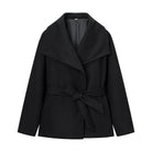 Elegant langry black wool coat with wide lapel and tie belt for winter fashion