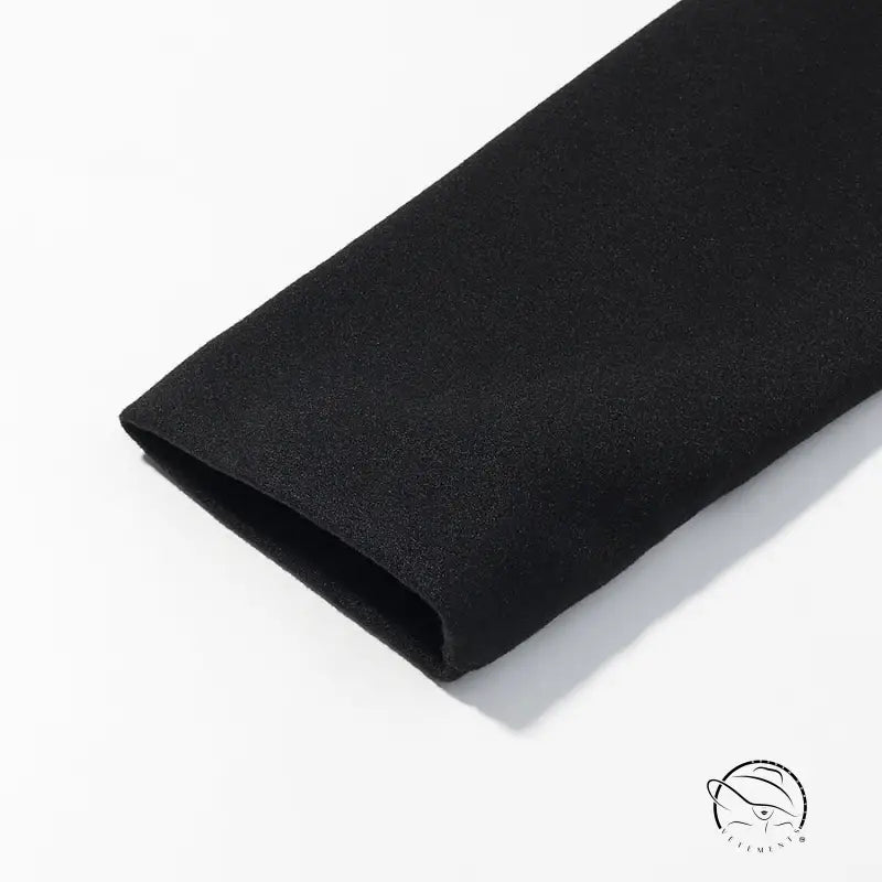 Black textured fabric wristband on elegant woolen coat