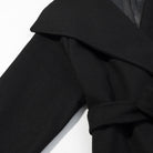 Elegant Langry black wool coat with ruffled sleeves and lapel collar