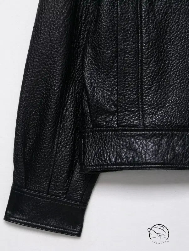 Elegant langry faux leather bomber jacket with textured surface and rolled cuffs