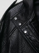 Elegant faux leather bomber jacket by Langry with black texture, silver buttons, and zipper