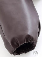 Trendy langry fashion jacket with brown leather glove and elastic wristband