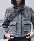 Gray tweed jacket in Langry fashion with plaid bow tie and button closure