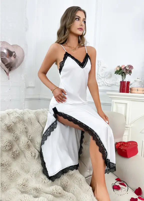 Elegant white lace-trimmed satin langry nightdress with high slit and spaghetti straps