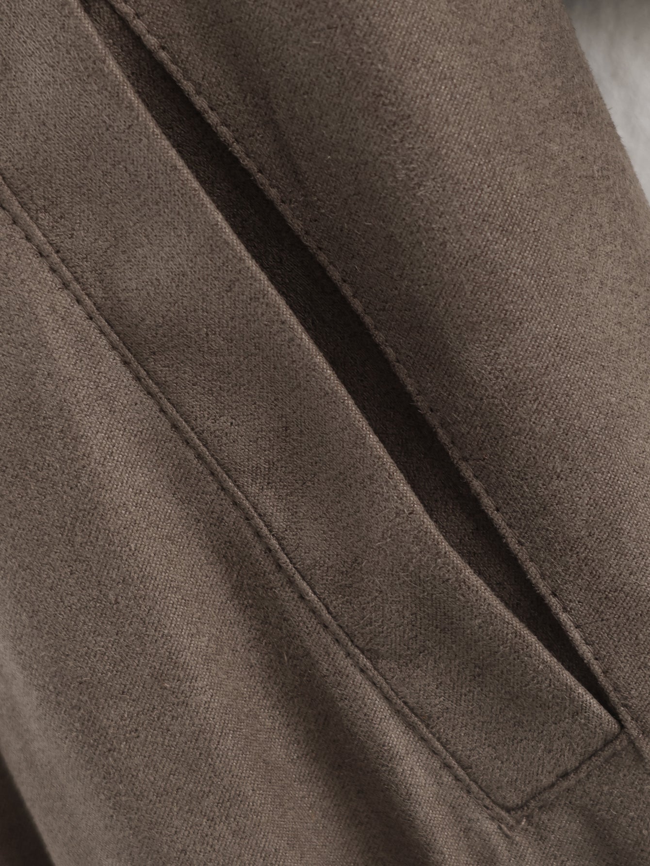 Close-up of Warm & Cozy langry suede jacket in fashion ملابس