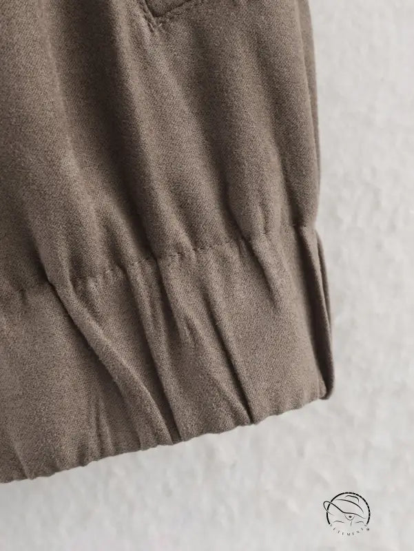 Warm cozy suede jacket in soft muted olive-green cotton fabric with wrinkled texture and gathered hem, langry fashion ملابس