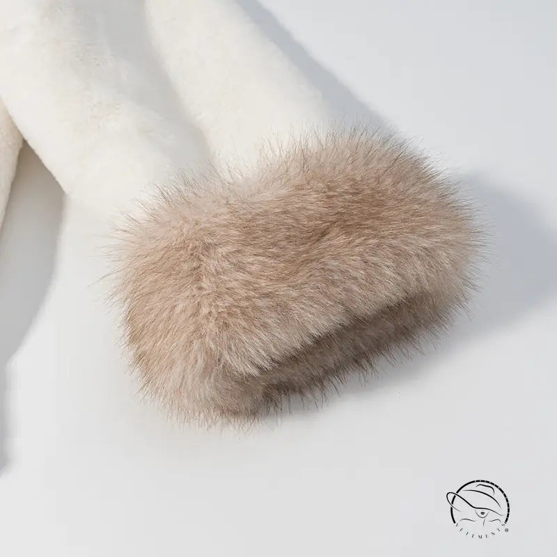 Cream-colored faux fur cuff in Langry fashion with soft, fluffy texture
