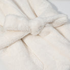 Plush white faux fur robe with fluffy texture and waist bow by Langry fashion