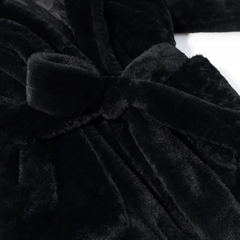Black faux fur robe with plush velvet texture and waist bow by Langry fashion