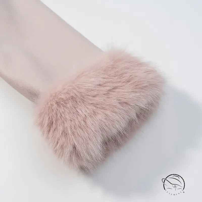 Blush-pink faux fur cuff on sheer sleeve of Langry elegant woolen coat