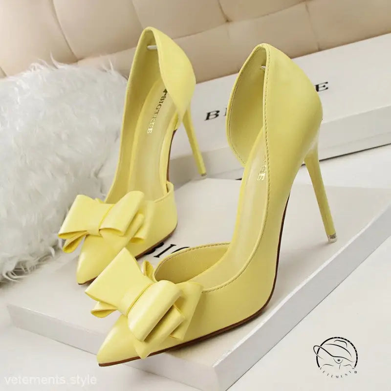 Yellow stiletto high heels with bows, perfect blend of elegance