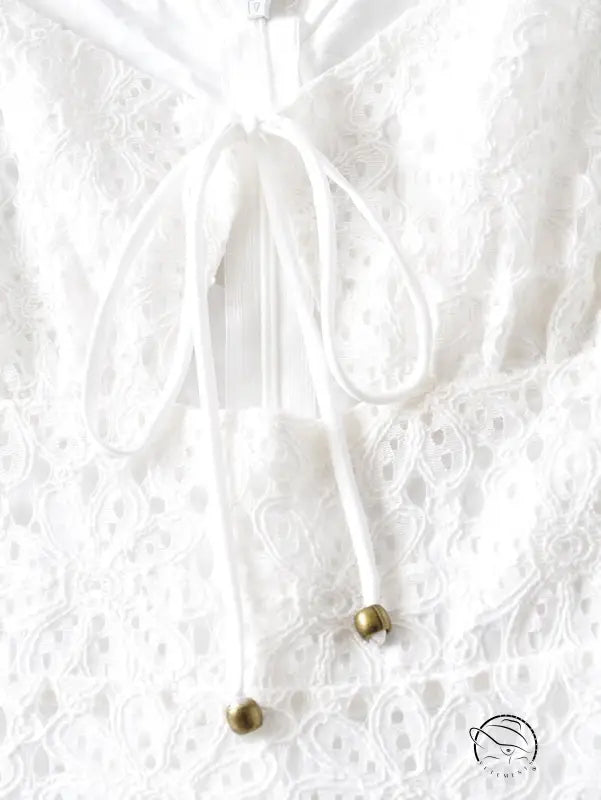 Elegant short lace up dress with white lace top and tie detail