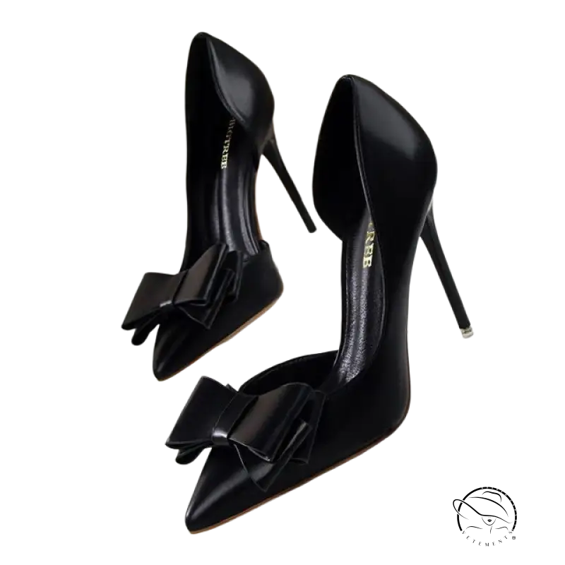 Elegant sweet high-heeled pumps in black patent leather with toe bow