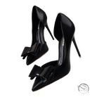 Elegant sweet high-heeled pumps in black patent leather with toe bow