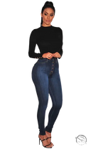 Woman in black top and waist stretch slim skinny denim blue casual jeans