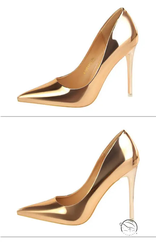 Elegant pair of gold stiletto heels in fashionable metal high heels style