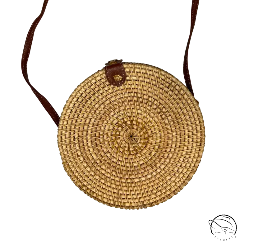Stylish sustainable handbag: round natural woven rattan crossbody with brown leather strap