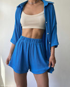 Woman in blue comfy loose loungewear featuring long sleeve shorts for ultimate relaxation