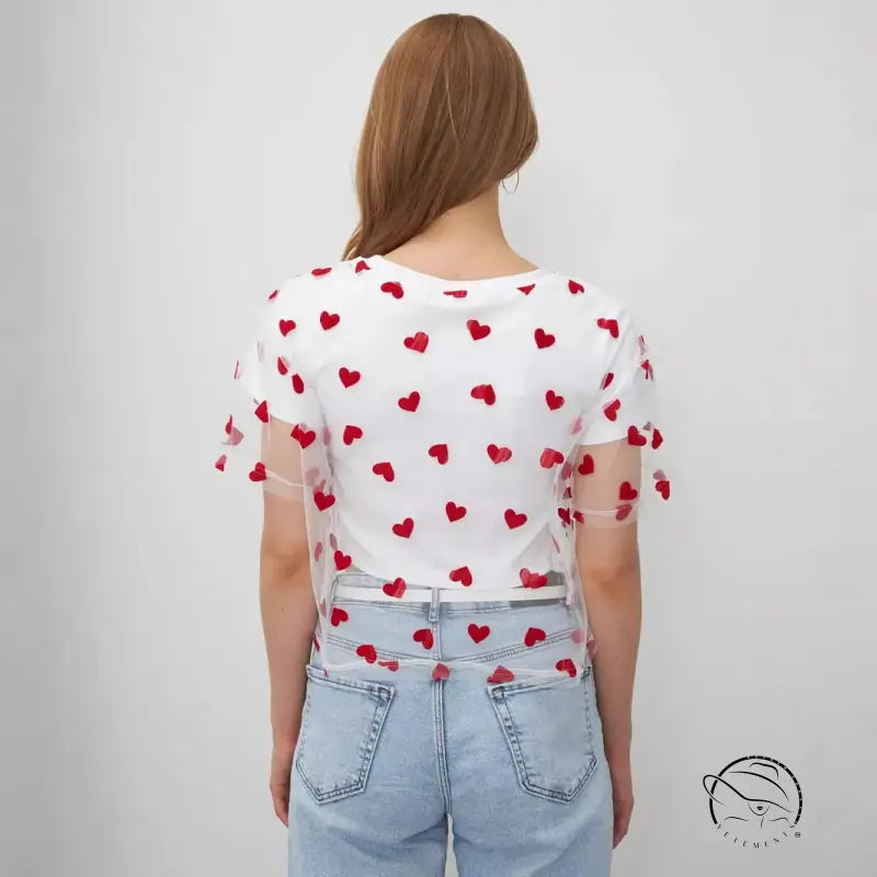 Elegant faux cotton short top with red heart pattern on white t-shirt and light blue jeans