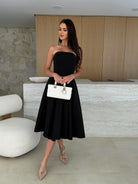 Elegant strapless black dress from Gorgeous Midi Dress, a must-have in langry fashion ملابس