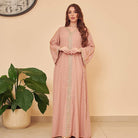Elegant dusty rose langry abaya with intricate embroidery and flowing sleeves
