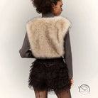 Beige faux fur langry cardigan coat with ruffled lace skirt and fishnet stockings