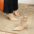 Langry beige suede ankle boot with pointed toe, thin heel, and decorative buckle