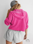 Hot pink cropped langry fashion hoodie with gray striped shorts and cap