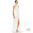 Gorgeous white halter neck gown with high split and tight waist