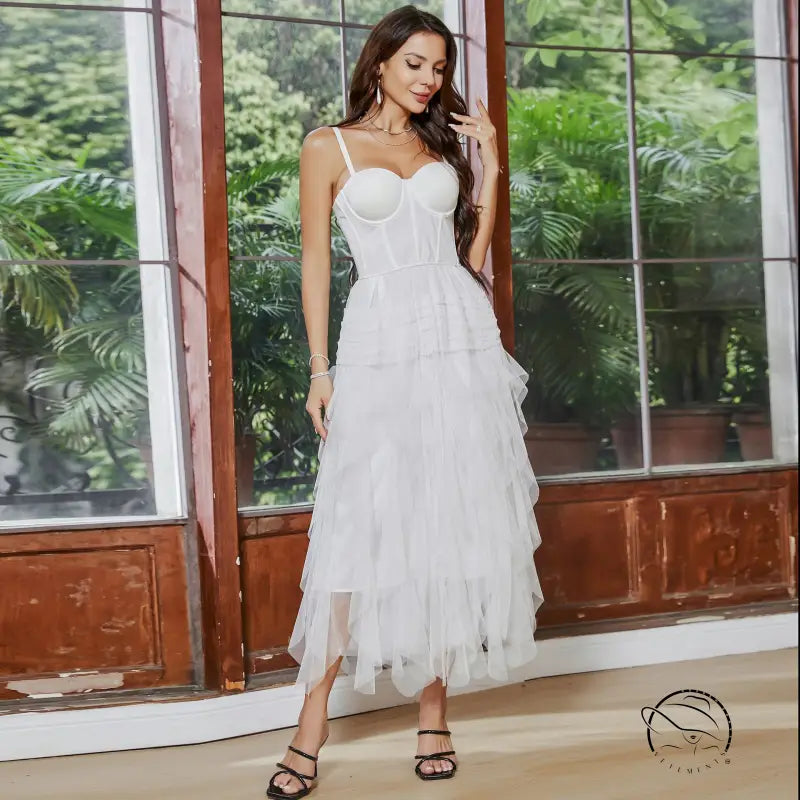 White tiered tulle French tube dress with yarn straps and large swing