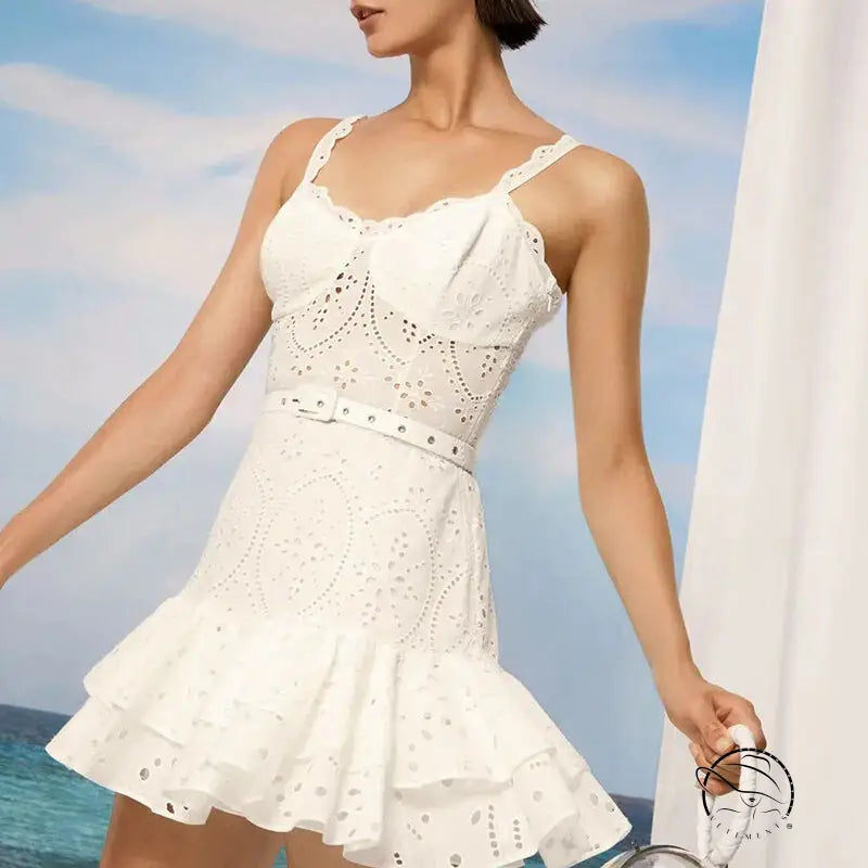 White eyelet lace summer machine embroidery sundress with spaghetti straps, ruffled hem, and waist slimming design