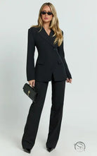 Black slim fit blazer with tailored pants from high-end brand