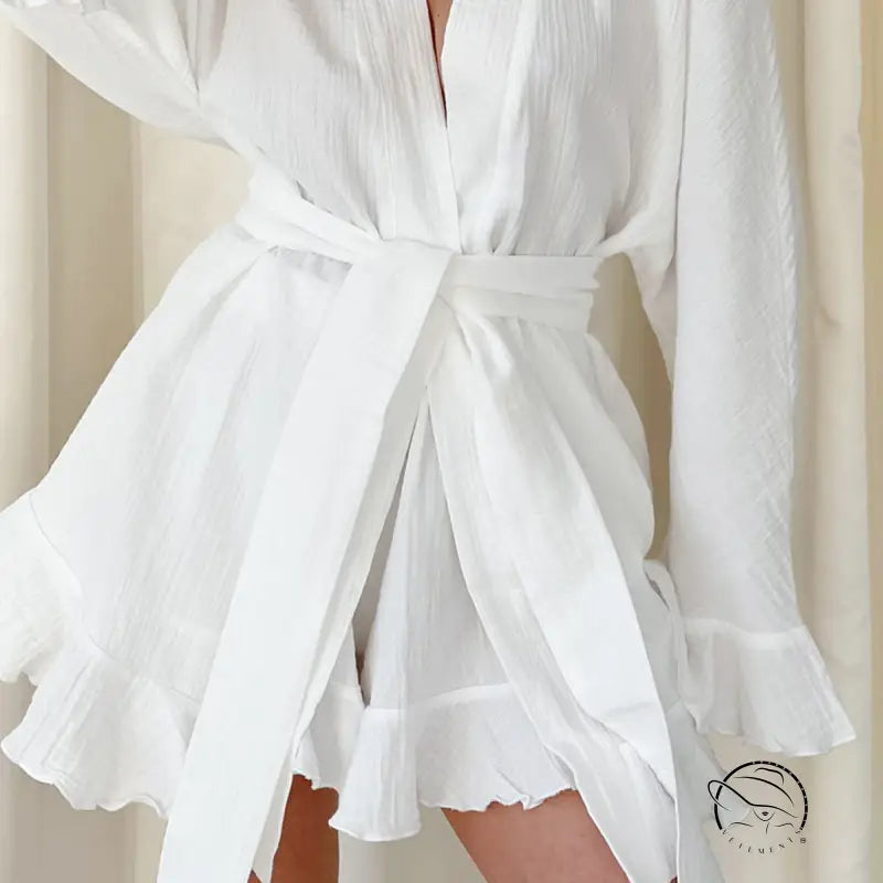 White ruffled mini wrap dress in loose shorts ruffled pajamas style