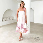 Attractive backless dress in white with pink floral hem embroidery