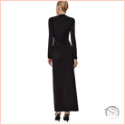 Black long-sleeved fitted maxi dress with ruched waist and high neckline