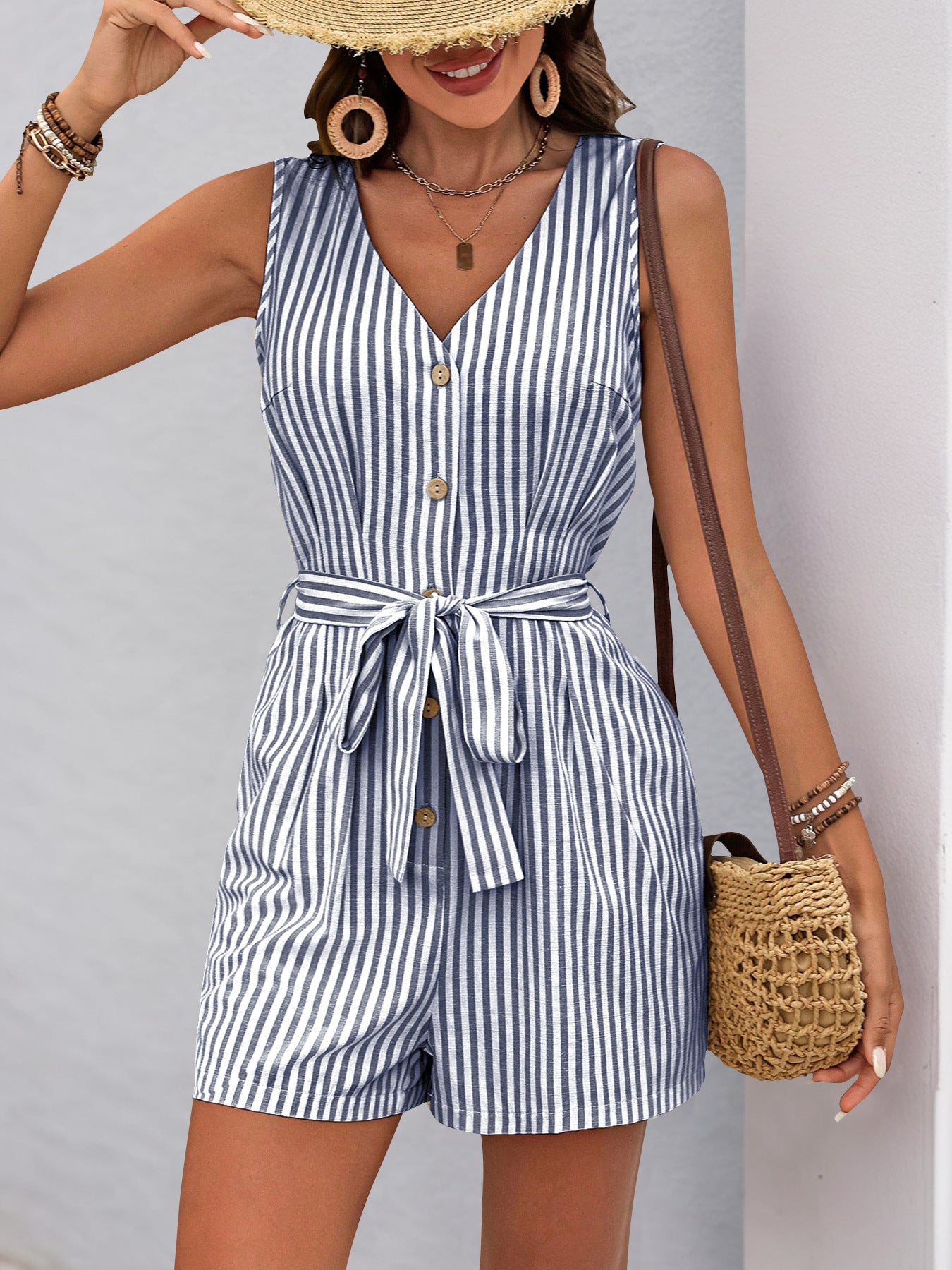 Sleeveless striped romper with v-neck and waist tie, perfect for summer fashion ملابس