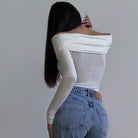 Langry fashion white off-shoulder bodysuit with jeans and ruched details