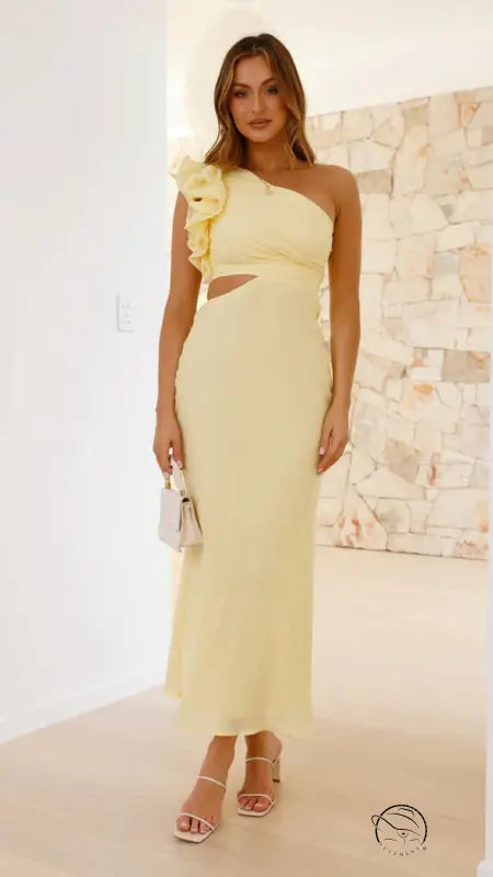 Woman in enchanting slim fit yellow one-shoulder dress