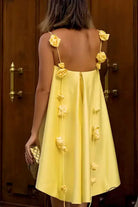 Casual loose vacation dress in yellow with floral embellishments