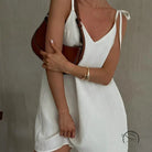 White textured mini dress with casual backless cotton tie straps