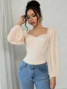 Elegant retro jumpsuit in cream chiffon with square neckline and bell sleeves