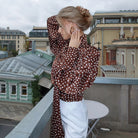 Elegance Polka Dot Shirt: Long-Sleeve Fashion Blouse on Brown Background