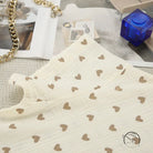 Cream-colored cotton linen fabric with brown heart patterns on summer slit shorts set