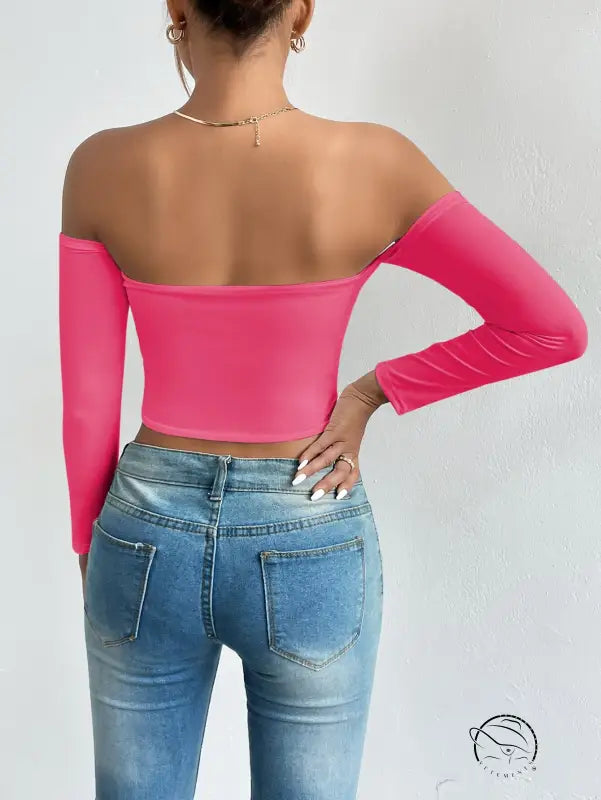 Bright pink camisole waist trimming short sleeve crop top with blue jeans