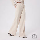 Cream-colored loose fitness warm pants with relaxed fit and elastic waistband
